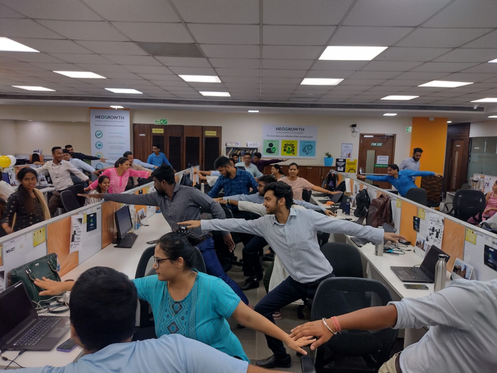 A corporate yoga session in an office